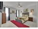 Spacious main bedroom with plush carpet, ceiling fan, and ample natural light at 79 S Reindeer Rd., Surfside Beach, SC 29575