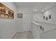 Upstairs hallway with neutral walls and carpet, offering access to multiple rooms at 79 S Reindeer Rd., Surfside Beach, SC 29575