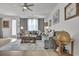 Spacious living room boasts a plush sectional sofa, stylish rug, and decorative globe at 79 S Reindeer Rd., Surfside Beach, SC 29575