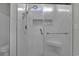 This glass enclosed shower features modern fixtures and a built in bench at 79 S Reindeer Rd., Surfside Beach, SC 29575