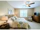 Inviting bedroom featuring natural light, comfortable bed, and charming decor at 82 Mingo Dr. # 2D, Pawleys Island, SC 29585
