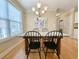 Charming dining area with modern lighting fixture, hardwood floors, and stylish decor at 82 Mingo Dr. # 2D, Pawleys Island, SC 29585