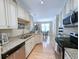 Contemporary kitchen featuring stainless steel appliances, granite countertops, and open layout at 82 Mingo Dr. # 2D, Pawleys Island, SC 29585