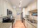 Well-equipped kitchen with stainless steel appliances, granite countertops, and ample cabinet space at 82 Mingo Dr. # 2D, Pawleys Island, SC 29585
