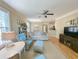 Bright living room with neutral decor, ceiling fan, hardwood floors, and comfortable seating arrangements at 82 Mingo Dr. # 2D, Pawleys Island, SC 29585