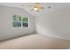The room offers an abundance of light and neutral carpeting throughout at 821 Laquinta Loop, Murrells Inlet, SC 29576