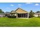 Charming home featuring a screened porch, well-maintained lawn, and simple landscaping at 821 Laquinta Loop, Murrells Inlet, SC 29576