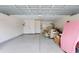 Spacious garage with epoxy flooring, ample storage shelves, and plenty of room for parking and projects at 821 Laquinta Loop, Murrells Inlet, SC 29576