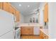 Spacious kitchen equipped with wooden cabinets and updated appliances for modern living at 821 Laquinta Loop, Murrells Inlet, SC 29576