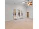 Bright living room featuring a ceiling fan and a door leading to the outside at 821 Laquinta Loop, Murrells Inlet, SC 29576