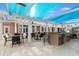Outdoor patio with a large grill, seating, ceiling fans, and pergola for shade at 821 Laquinta Loop, Murrells Inlet, SC 29576
