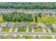 Real estate aerial view of a quiet suburban neighborhood, full of lush greenery and mature trees at 832 Windsor Rose Dr., Conway, SC 29526