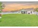Spacious fenced-in backyard with lush green grass and a covered patio area at 832 Windsor Rose Dr., Conway, SC 29526