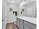 This bright bathroom features a double vanity and a large mirror at 832 Windsor Rose Dr., Conway, SC 29526