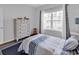 Bright bedroom features a large window and neutral decor at 832 Windsor Rose Dr., Conway, SC 29526