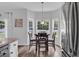 Bright dining area with views from bay window, set near stainless steel refrigerator at 832 Windsor Rose Dr., Conway, SC 29526
