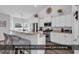 Modern kitchen features stainless steel appliances, white cabinets, and a breakfast bar area at 832 Windsor Rose Dr., Conway, SC 29526