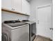 Laundry room with white cabinets and modern washer and dryer at 832 Windsor Rose Dr., Conway, SC 29526