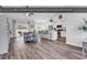 Open concept living room that blends seamlessly into the kitchen area; vinyl flooring throughout at 832 Windsor Rose Dr., Conway, SC 29526