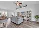 Open living room featuring vaulted ceilings, stylish decor, and ample natural light at 832 Windsor Rose Dr., Conway, SC 29526