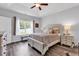 Cozy main bedroom with neutral decor, tray ceiling, and ample natural light at 832 Windsor Rose Dr., Conway, SC 29526