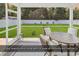 Relaxing screened-in porch with comfortable seating and a view of the backyard at 832 Windsor Rose Dr., Conway, SC 29526