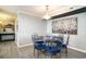 Dining area with seating for six people, modern lighting and luxury vinyl plank flooring at 8560 Queensway Blvd. # 106, Myrtle Beach, SC 29572