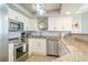 Bright kitchen with stainless steel appliances and granite countertops at 8560 Queensway Blvd. # 106, Myrtle Beach, SC 29572
