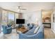 Cozy living room featuring comfortable seating, balcony access, and modern decor at 8560 Queensway Blvd. # 106, Myrtle Beach, SC 29572