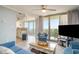 Living room space with comfortable seating, balcony access, and open floor plan at 8560 Queensway Blvd. # 106, Myrtle Beach, SC 29572