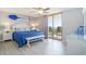 Coastal bedroom with ocean view balcony and nautical decor at 8560 Queensway Blvd. # 106, Myrtle Beach, SC 29572
