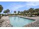 Large rectangular pool with palm trees and beach access at 8560 Queensway Blvd. # 106, Myrtle Beach, SC 29572