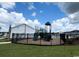 Community playground with slide and climbing structure, surrounded by black metal fencing at 860 Long Beach Dr, Longs, SC 29568