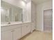 Bright bathroom features a double sink vanity and a walk-in closet for ample storage at 863 Long Beach Dr, Longs, SC 29568