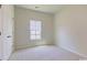 Light-filled bedroom features a window and a closet for a comfortable living space at 863 Long Beach Dr, Longs, SC 29568