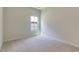 Bright bedroom with neutral carpet and window offers natural light and cozy appeal at 863 Long Beach Dr, Longs, SC 29568