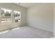 Inviting bedroom filled with natural light through two windows, offers a relaxing atmosphere at 863 Long Beach Dr, Longs, SC 29568