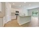 Modern kitchen with white cabinets, granite countertops, stainless steel appliances, and hardwood floors at 863 Long Beach Dr, Longs, SC 29568
