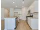 Well-lit kitchen featuring white cabinets, stainless steel appliances, granite countertops, and a convenient center island at 863 Long Beach Dr, Longs, SC 29568