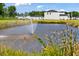 Scenic pond with a fountain and surrounding landscape at 863 Long Beach Dr, Longs, SC 29568