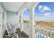 Relax on the balcony with rocking chairs and enjoy picturesque ocean views at 931 S Ocean Blvd., North Myrtle Beach, SC 29582