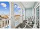 Relax on the balcony with rocking chairs and enjoy picturesque ocean views at 931 S Ocean Blvd., North Myrtle Beach, SC 29582