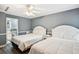 Bedroom with two beds, ceiling fan, and adjoining bath at 931 S Ocean Blvd., North Myrtle Beach, SC 29582