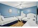 Light blue bedroom features three beds, a dresser, and modern decor at 931 S Ocean Blvd., North Myrtle Beach, SC 29582