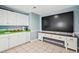 Game room featuring kitchenette, fireplace, and large screen TV at 931 S Ocean Blvd., North Myrtle Beach, SC 29582