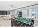 Spacious game room with foosball table, arcade game and TV at 931 S Ocean Blvd., North Myrtle Beach, SC 29582