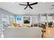 Comfortable living room featuring a large sofa, built-in shelving, and natural light from ocean view at 931 S Ocean Blvd., North Myrtle Beach, SC 29582
