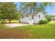 Charming backyard features a cozy patio, lush lawn, and a well-maintained exterior at 1004 Georgetown St., Marion, SC 29571