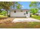The backyard features a cozy patio and well-maintained lawn, offering an ideal outdoor living space at 1004 Georgetown St., Marion, SC 29571