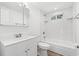 Spotless white bathroom features a vanity sink, toilet, and a shower-tub with white subway tile at 1004 Georgetown St., Marion, SC 29571